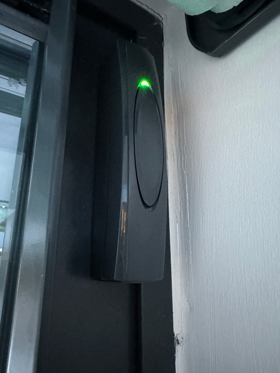 Texecom vibration and contact sensor installed on a door frame