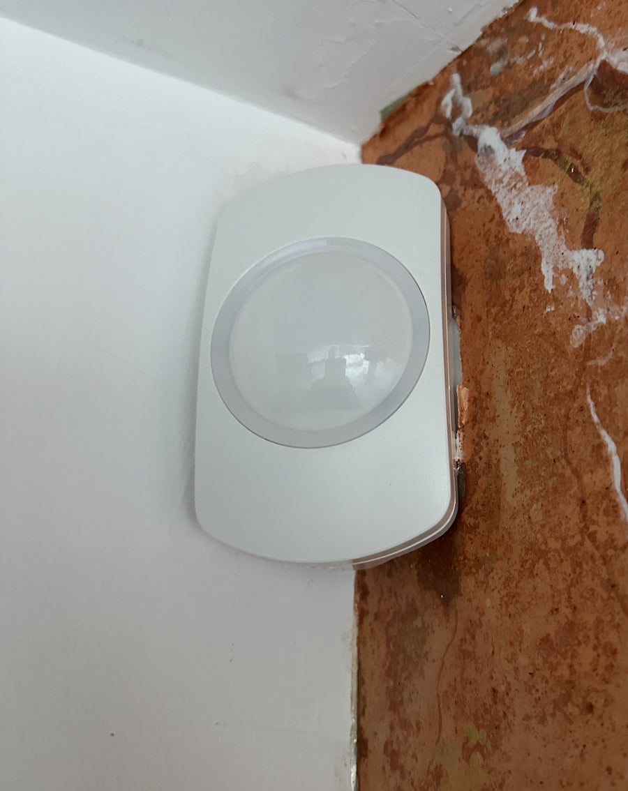 Texecom PIR motion sensor professionally installed in a property